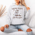 Celebrate the beauty of quirky connections with our comfy hoodie, featuring an adorable illustration of a raccoon and possum sharing a heartwarming hug.